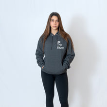 Load image into Gallery viewer, Charcoal Gray Hooded Sweatshirt with Be the Light Design on Left Chest
