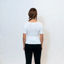 Load image into Gallery viewer, Rear View Deep scoop neck white t-shirt with Ari Arteaga&#39;s red heart on the left shoulder
