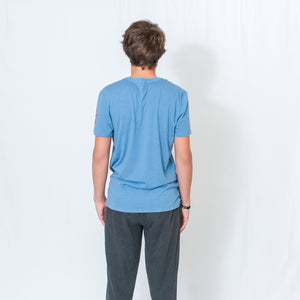 Rear View Denim Blue Short Sleeve Unisex T-Shirt with Ari's Heart and Be the Light Design in Red on Left Sleeve