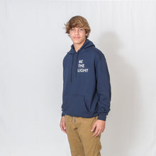 Load image into Gallery viewer, Heather Navy Hooded Sweatshirt with Be the Light Design on Left Chest
