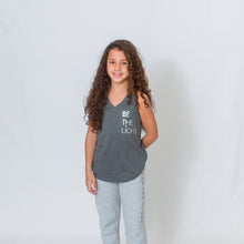 Load image into Gallery viewer, Girls granite v-neck sleeveless flowy racerback tank. BE THE LIGHT on the left chest in silver.
