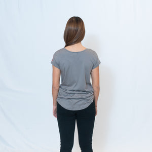 Rear View Nickel Gray Wide Neck T-shirt with Ari's Heart in Red on Left Shoulder