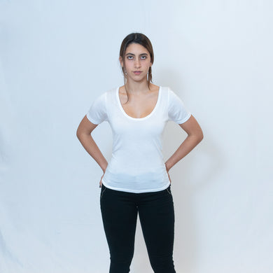 Deep scoop neck white t-shirt with Ari Arteaga's red heart on the left shoulder