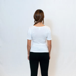 Rear View Deep scoop neck white t-shirt with Ari Arteaga's red heart on the left shoulder
