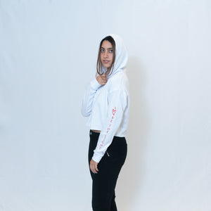 Simple white cropped hoodie with Be the Light written in red on the sleeve