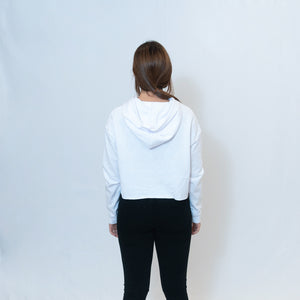 Rear view of white cropped hoodie with Be the Light written on the sleeve
