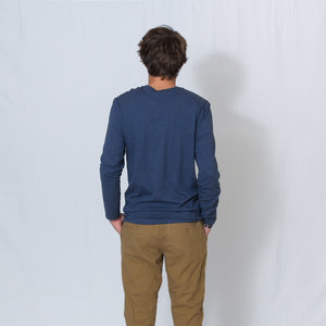Rear View Heather Navy Crew Neck Long Sleeve T-shirt with Ari's Heart and Be the Light in Red on the Left Shoulder