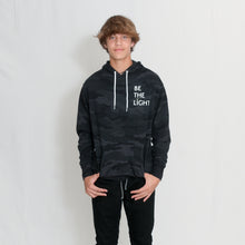 Load image into Gallery viewer, Be the Light White Text Unisex Lightweight Black Camo Hoodie with Kangaroo Pocket

